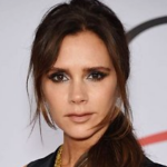 Victoria Beckham looks at the caera