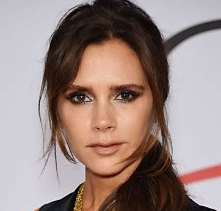 Victoria Beckham looks at the caera